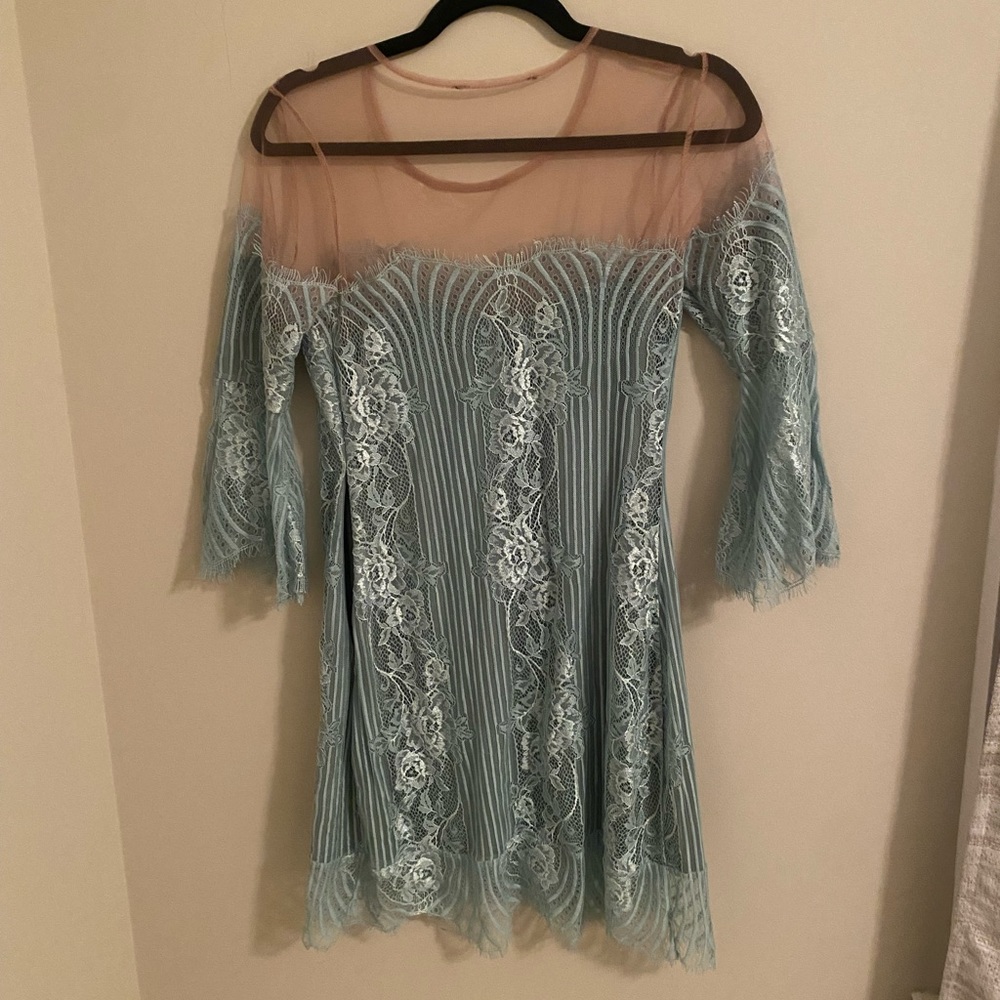 For love and lemons blue dress with nude chest covering. Lightly used.